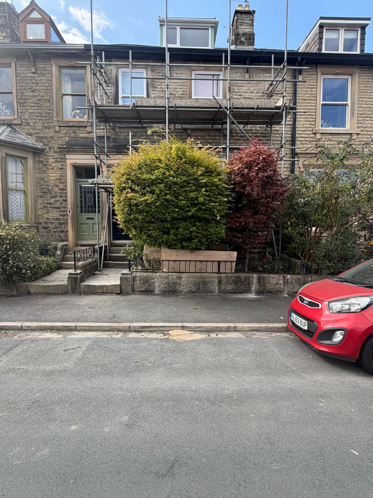Full street view of the Clitheroe terrace during restoration