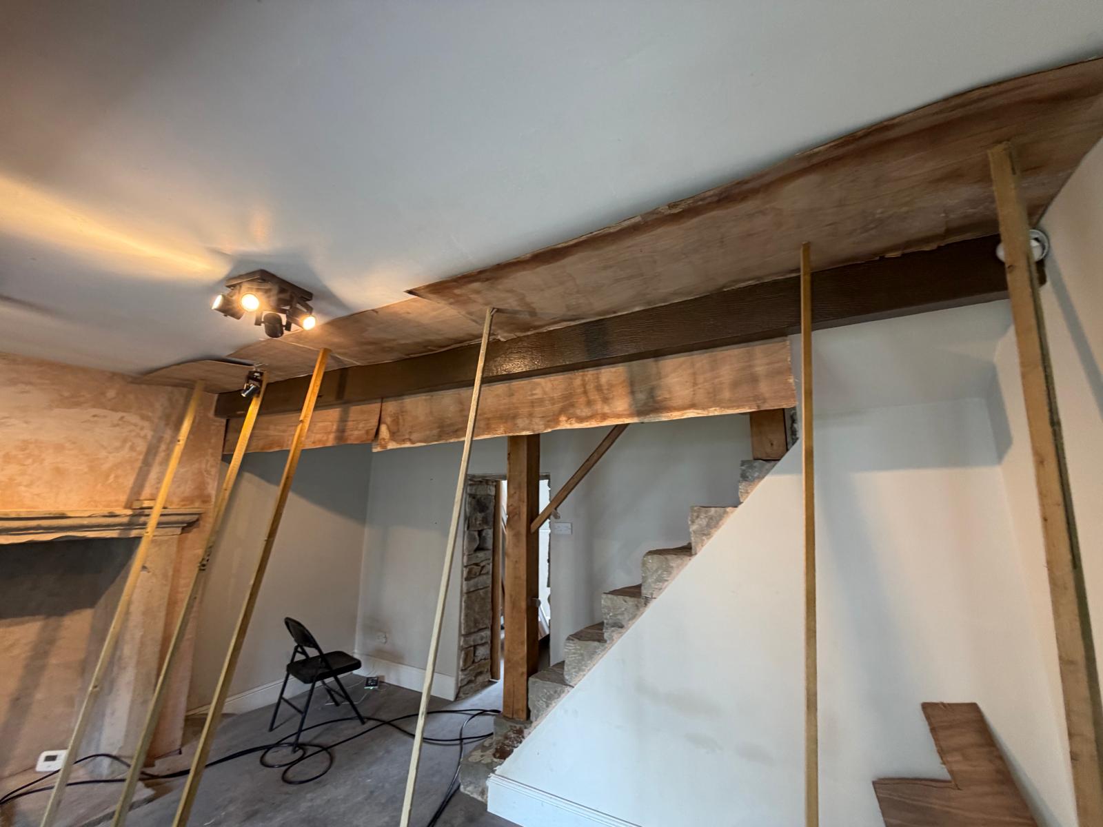 Oak beams and stone staircase mid-restoration, Burnley